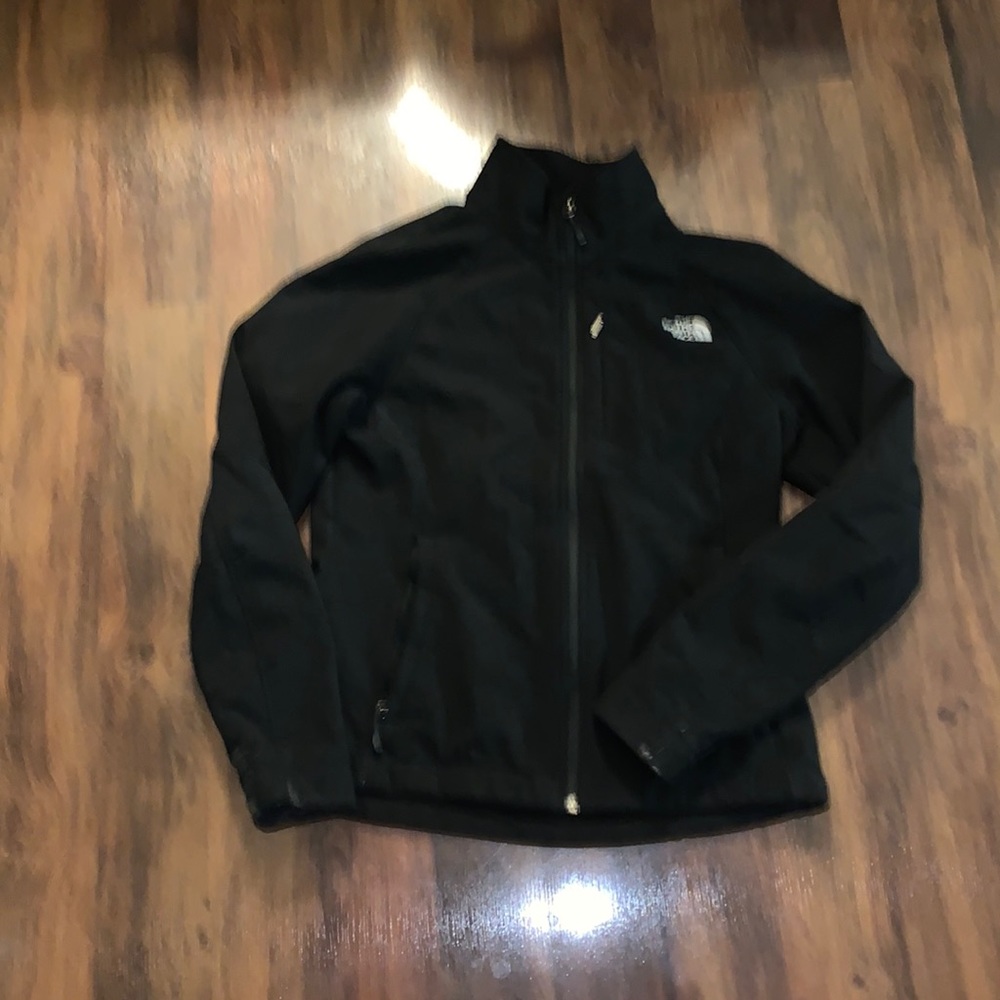 black jacket w/front pockets and chest pocket hard shell style w/ fleece lining